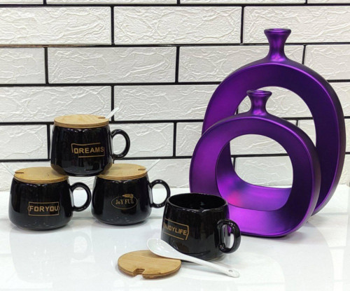 Black mug with wooden lid and spoon